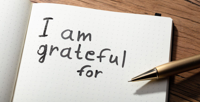 A notebook that says "I am grateful for" written with a pen